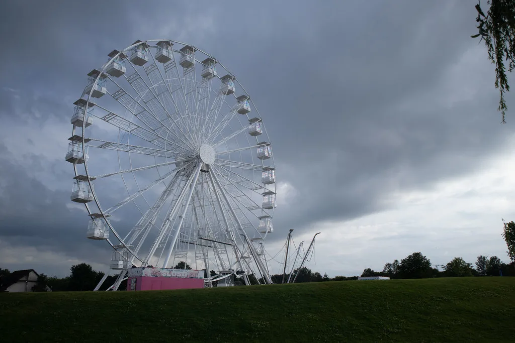 The Observation Wheel at Willen Lake, Milton Keynes. Willen On Ice is built on the lawn opposite it
